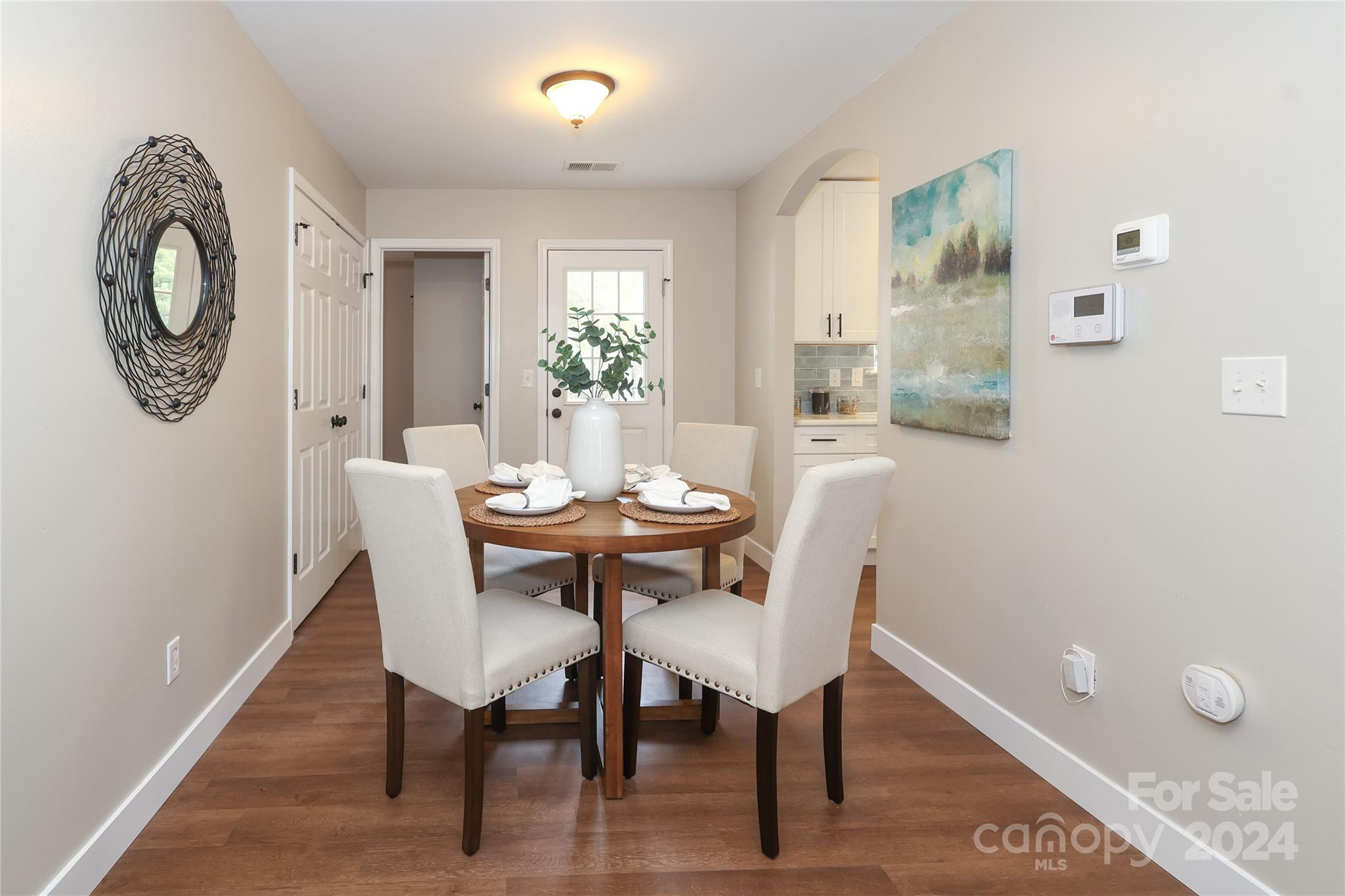 437 Radio Road Charlotte, NC 28216 - Photo 8 of 30 a view of a dining room with furniture and wooden floor