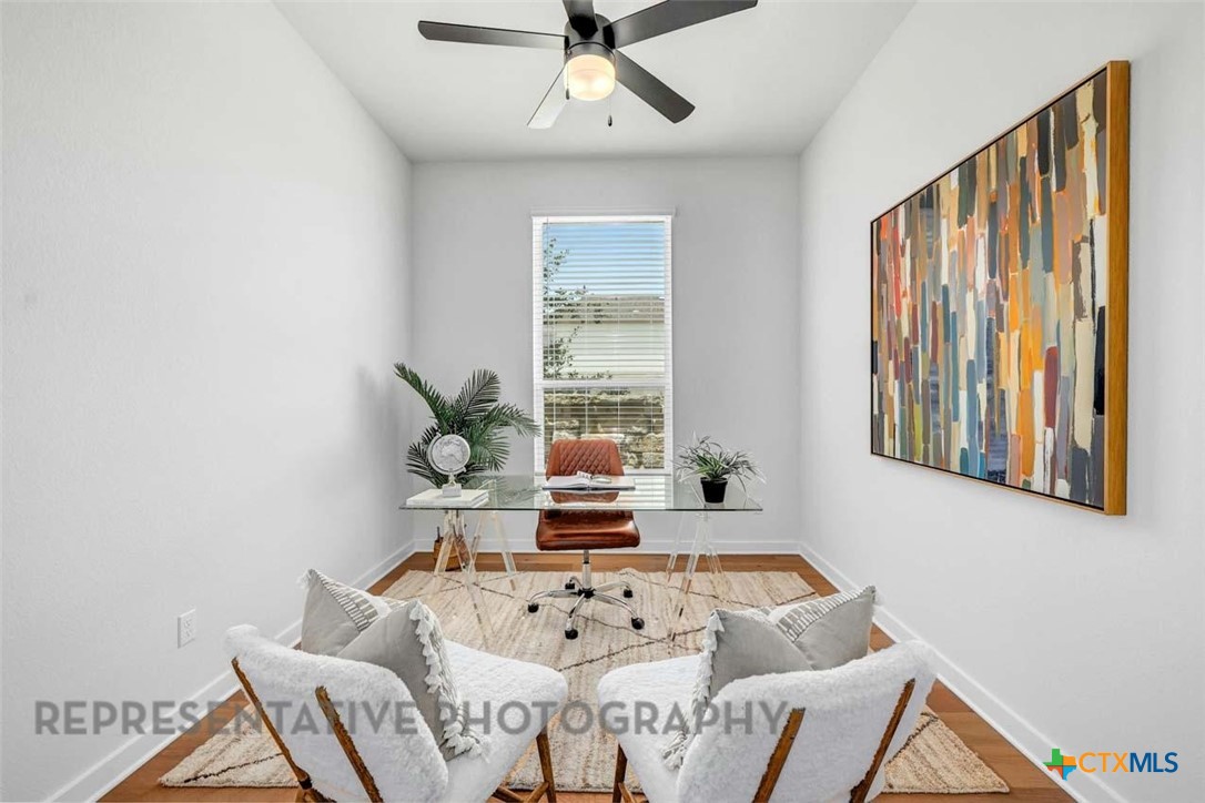 148 Spanish Oak Castroville, TX 78009 - Photo 11 of 20 a living room with furniture and window