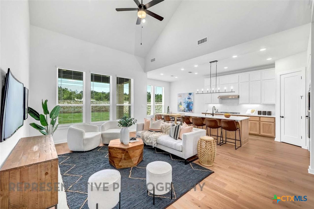 148 Spanish Oak Castroville, TX 78009 - Photo 5 of 20 a living room with furniture and a large window