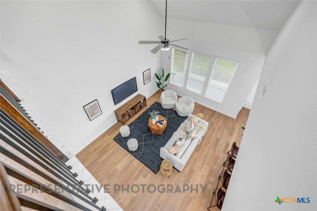 148 Spanish Oak Castroville, TX 78009 - Photo 7 of 20 a living room with furniture and floor to ceiling window