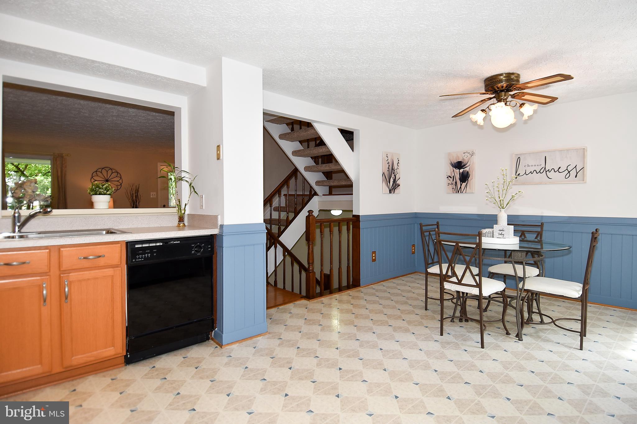 6591 Forest Dew Court Springfield, VA 22152 - Photo 14 of 39 Clean, tidy kitchen flows to staircase