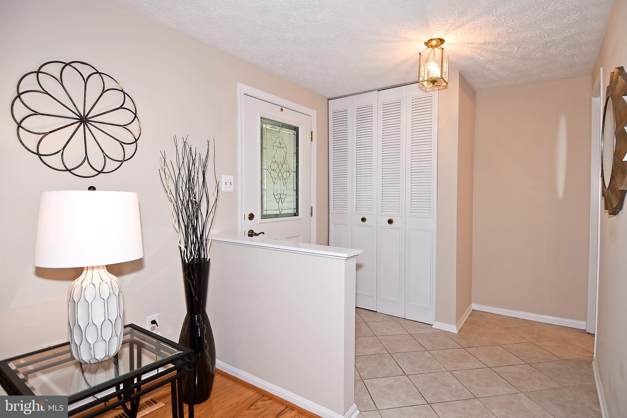 6591 Forest Dew Court Springfield, VA 22152 - Photo 3 of 39 Bright entryway opens to LR and 1/2 bath