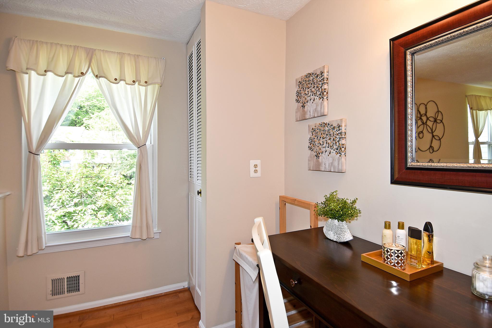 6591 Forest Dew Court Springfield, VA 22152 - Photo 22 of 39 Storage and seating/vanity in the master bedroom