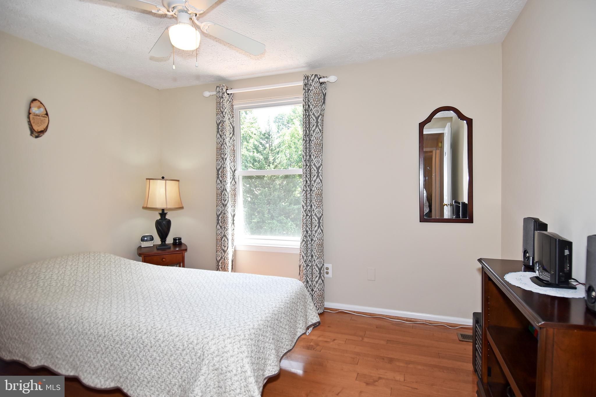 6591 Forest Dew Court Springfield, VA 22152 - Photo 24 of 39 Light and bright 2nd bedroom w/ hardwood floors