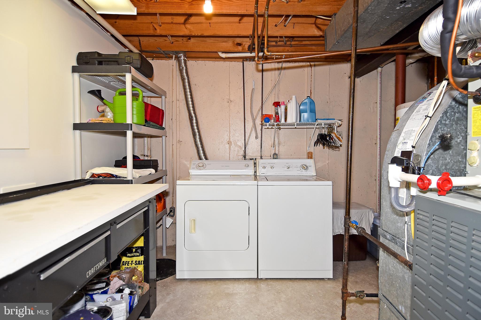 6591 Forest Dew Court Springfield, VA 22152 - Photo 32 of 39 Washer and dryer in the roomy laundry room