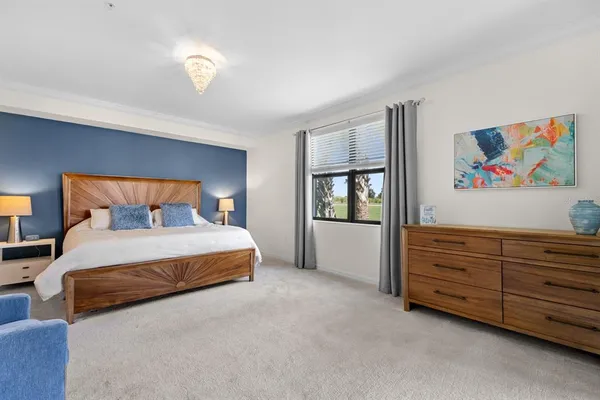a bedroom with bed and window