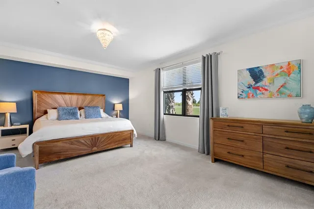 a bedroom with bed and window