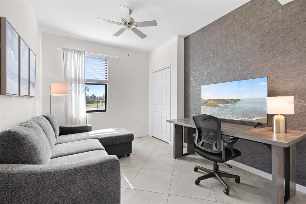 18117 Gawthrop Drive, Unit 104 Bradenton, FL 34211 - Photo 23 of 54 a view of a livingroom with workspace and a couch