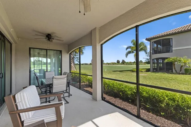 a view of a porch with furniture and wooden floor