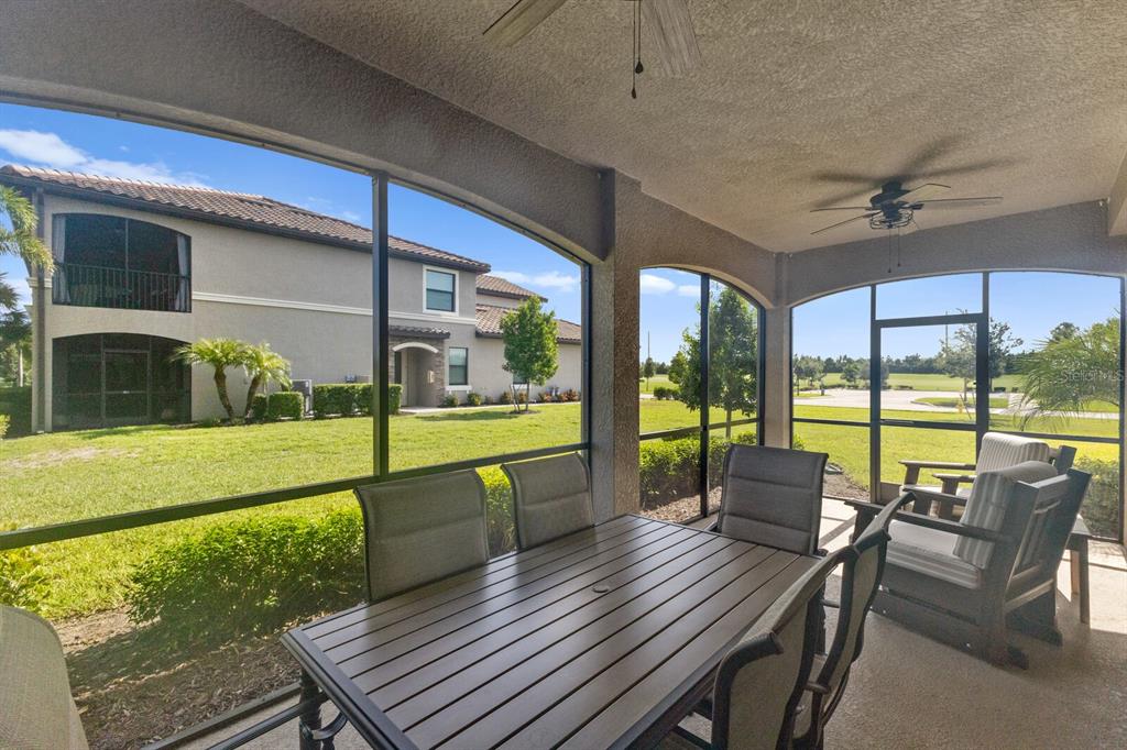 18117 Gawthrop Drive, Unit 104 Bradenton, FL 34211 - Photo 26 of 54 a view of a porch with furniture and wooden floor