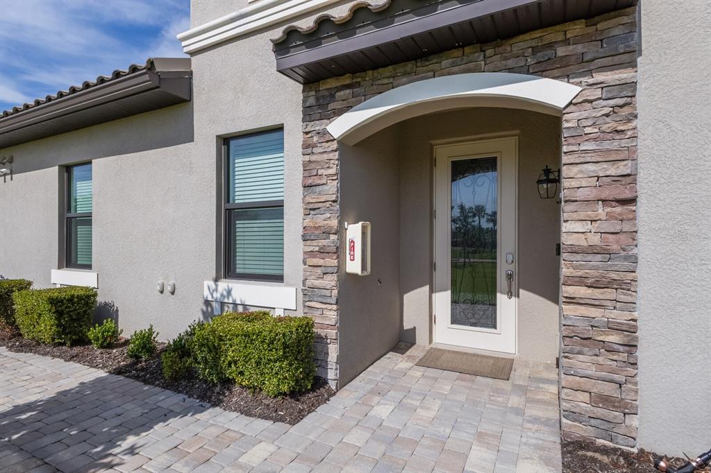 18117 Gawthrop Drive, Unit 104 Bradenton, FL 34211 - Photo 4 of 54 a front view of a house with a yard