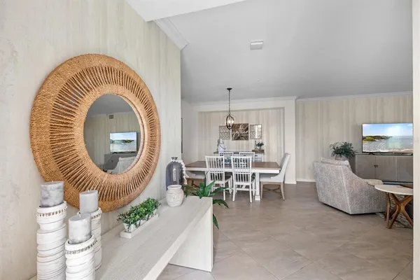 a living room with furniture a table and chairs