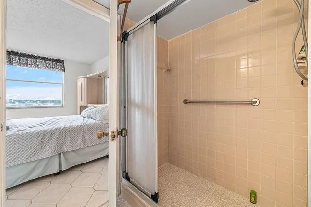 a bathroom with a bathtub and a shower