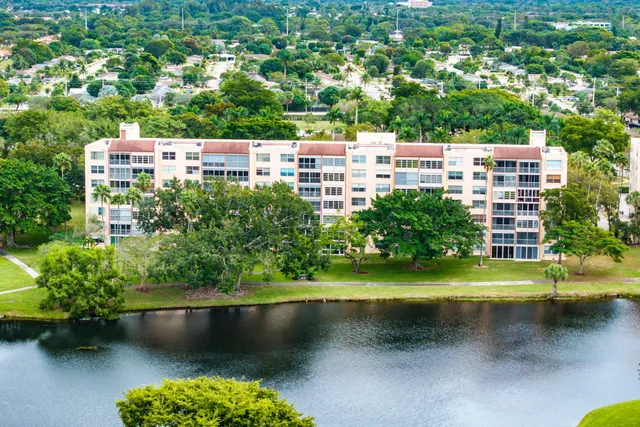 an aerial view of a house with a lake view