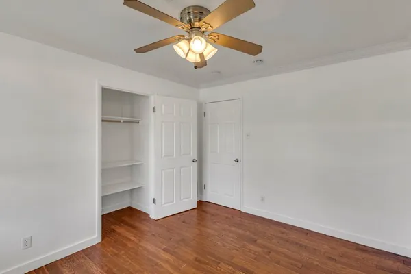 a backyard of a house with barbeque oven and outdoor seating