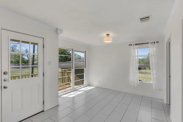 a view of a house with a yard and sitting area