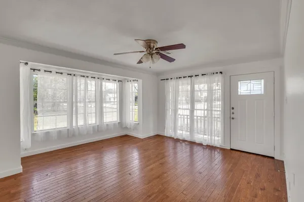 a view of an empty room with a window