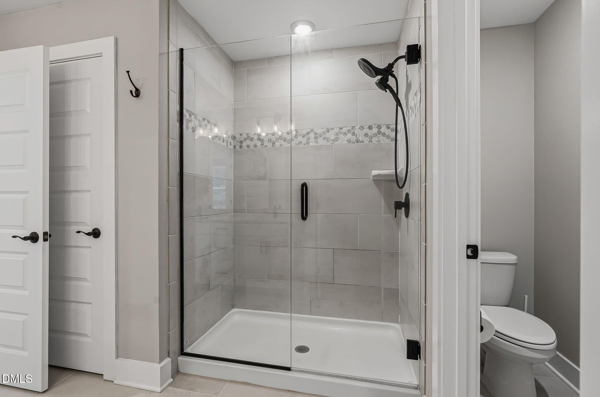 438 Diversity Way Raleigh, NC 27610 - Photo 28 of 33 a bathroom with a shower and toilet