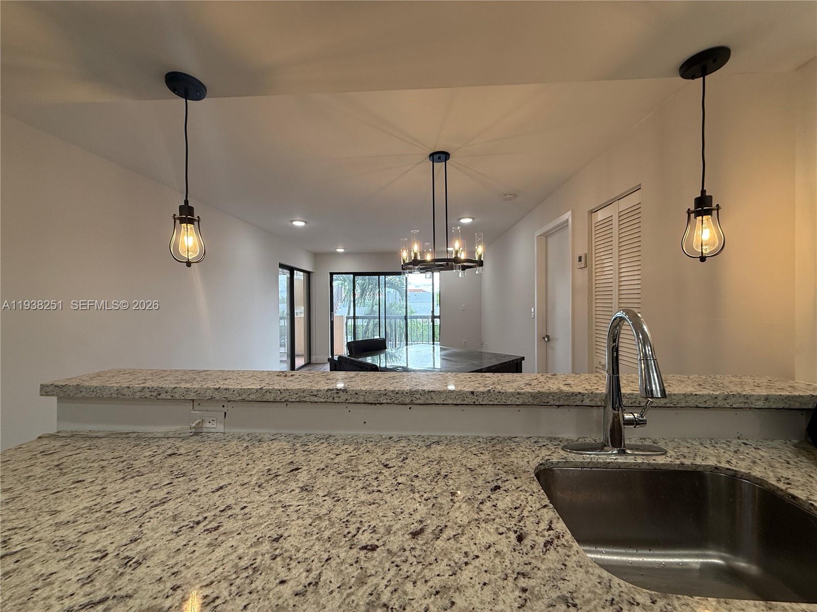 995 Southwest 84th Avenue, Unit 304 Miami, FL 33144 - Photo 4 of 15 a kitchen with a sink and a window