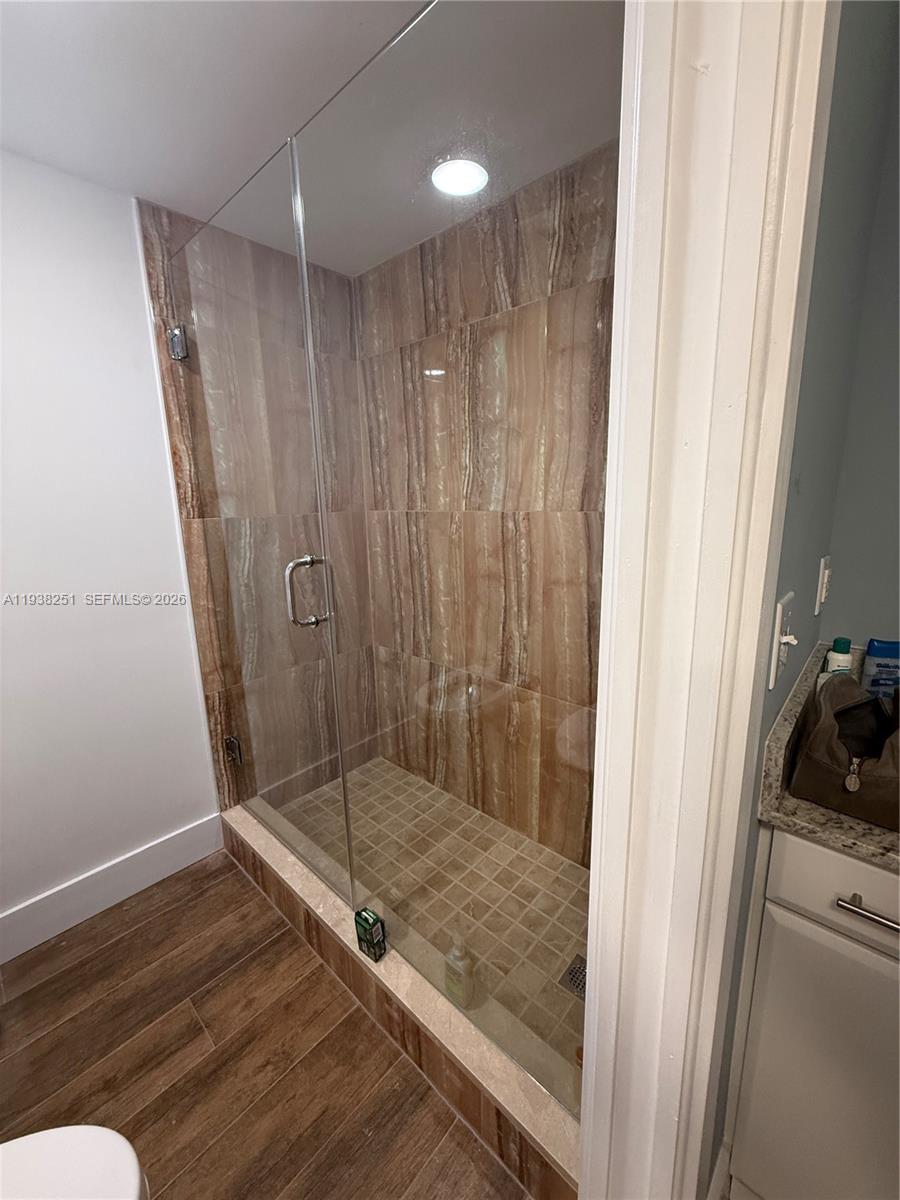 995 Southwest 84th Avenue, Unit 304 Miami, FL 33144 - Photo 9 of 15 a bathroom with a shower and a sink