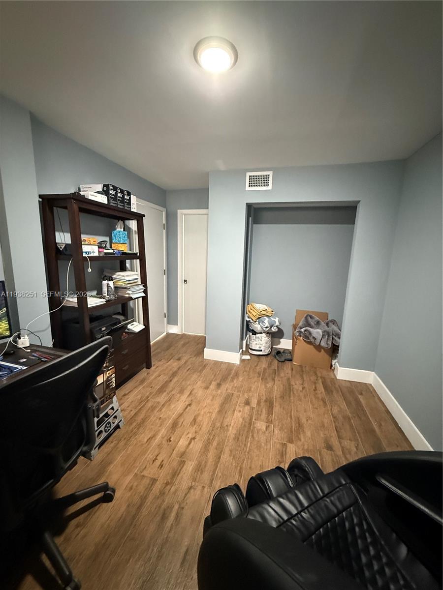 995 Southwest 84th Avenue, Unit 304 Miami, FL 33144 - Photo 10 of 15 a bed room with a bed and furniture