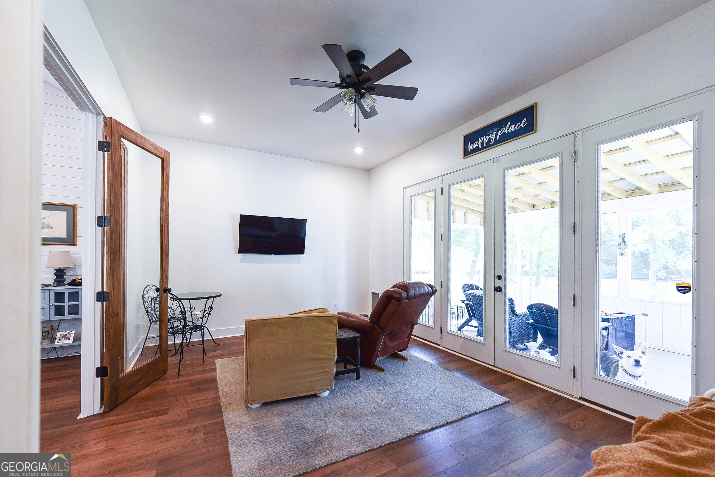 209 Lee Road Salem, AL 36874 - Photo 6 of 37 a living room with furniture and a floor to ceiling window