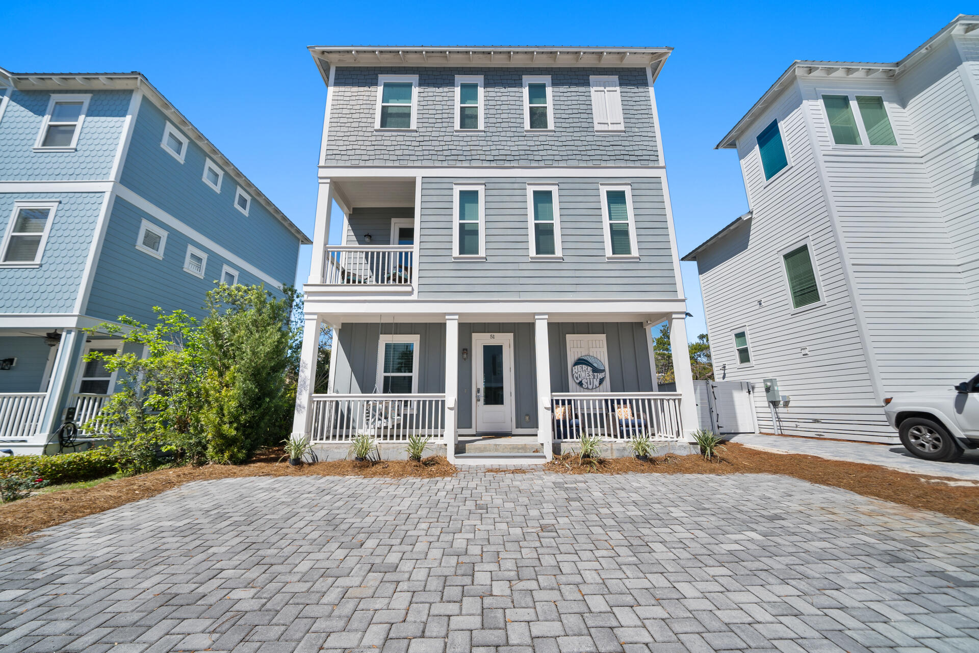 a front view of a building with many windows