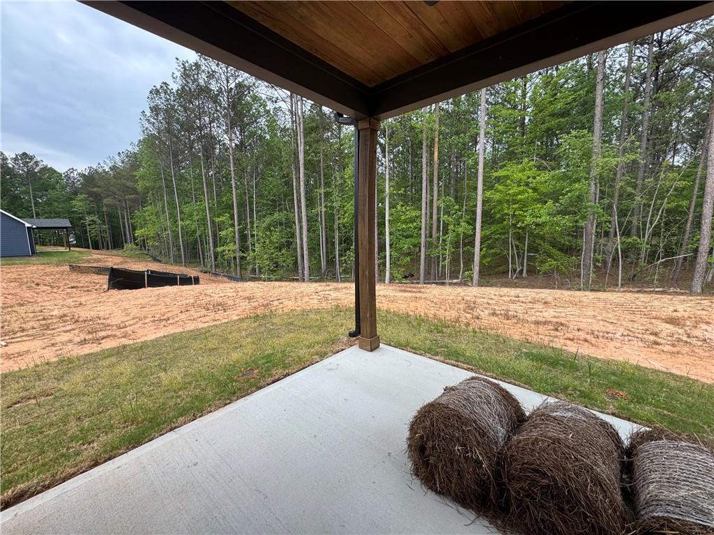 2057 North Hicks Road Toccoa, GA 30577 - Photo 22 of 22 a backyard of a house with table and chairs