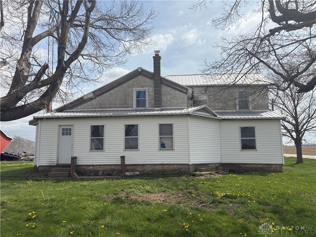 This charming residence is nestled among mature trees, offering a tranquil countryside setting.