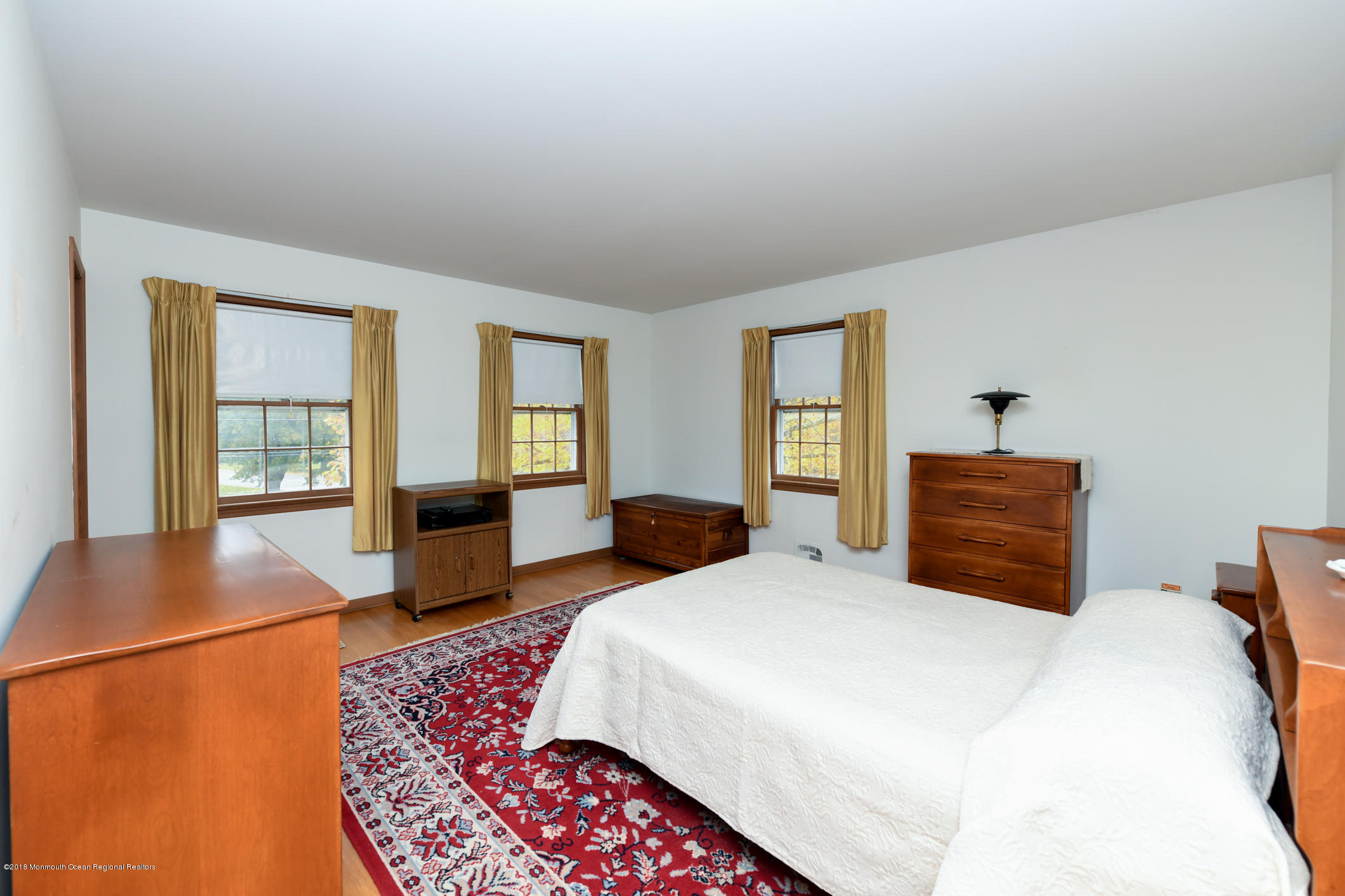 2 Green Hill Road Colts Neck, NJ 07722 - Photo 17 of 30 a bedroom with a large bed and a dresser