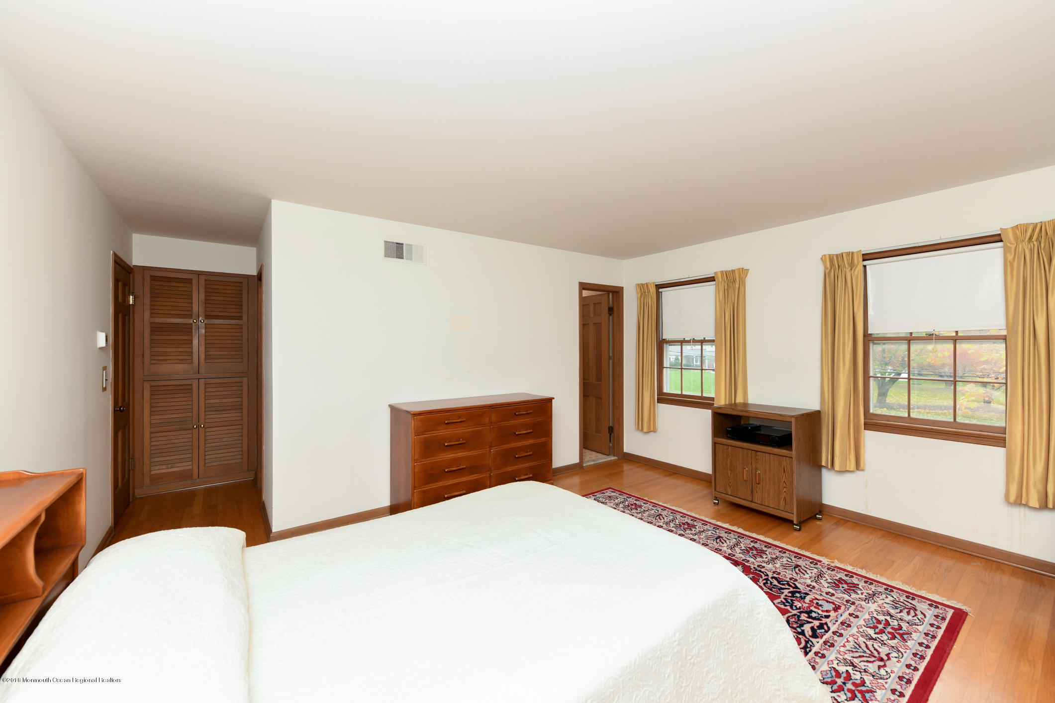 2 Green Hill Road Colts Neck, NJ 07722 - Photo 18 of 30 a bedroom with a bed dresser and a window
