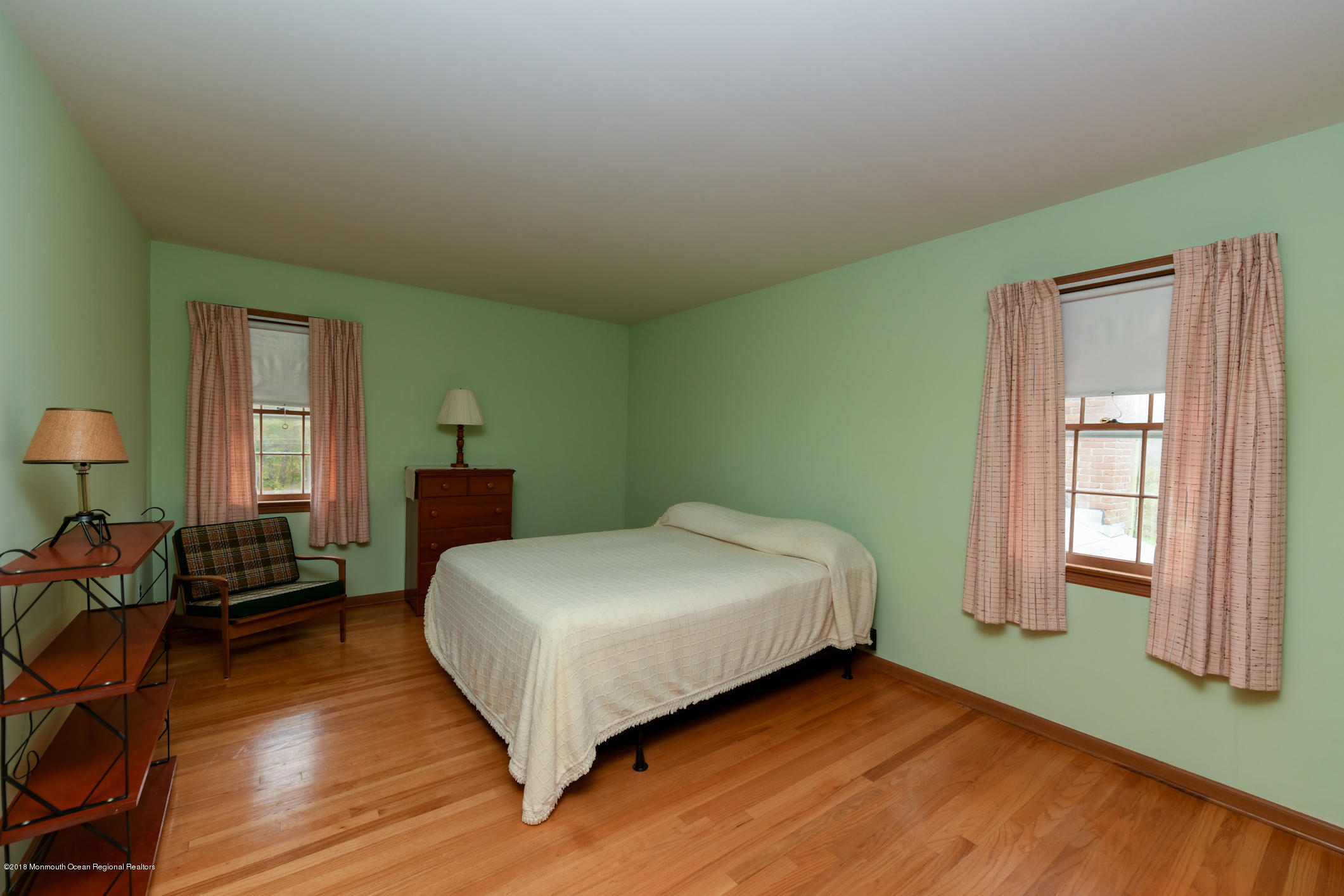 2 Green Hill Road Colts Neck, NJ 07722 - Photo 20 of 30 a bedroom with a bed and wooden floor