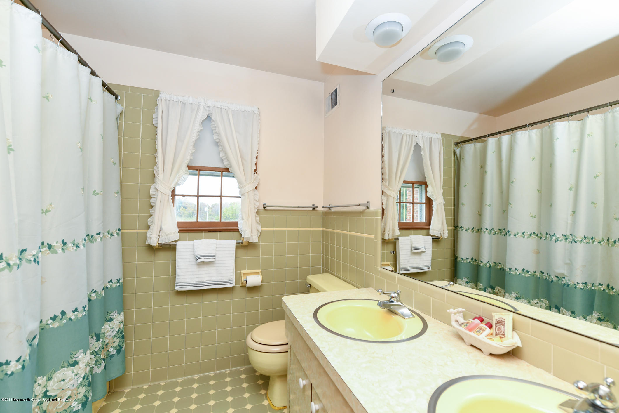 2 Green Hill Road Colts Neck, NJ 07722 - Photo 21 of 30 a bathroom with a granite countertop sink toilet a mirror and shower curtain