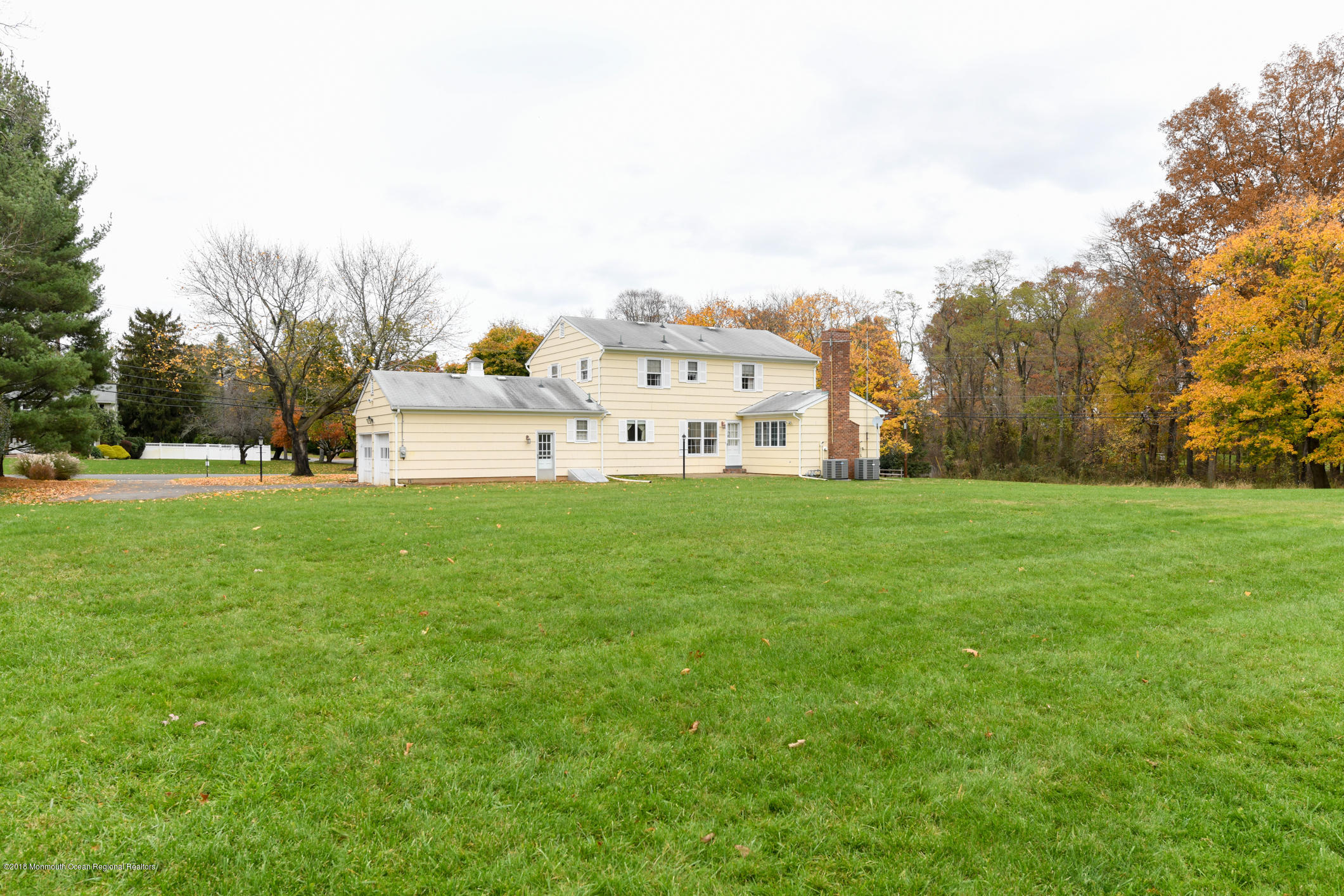 2 Green Hill Road Colts Neck, NJ 07722 - Photo 29 of 30 a view of a house with a big yard and large trees