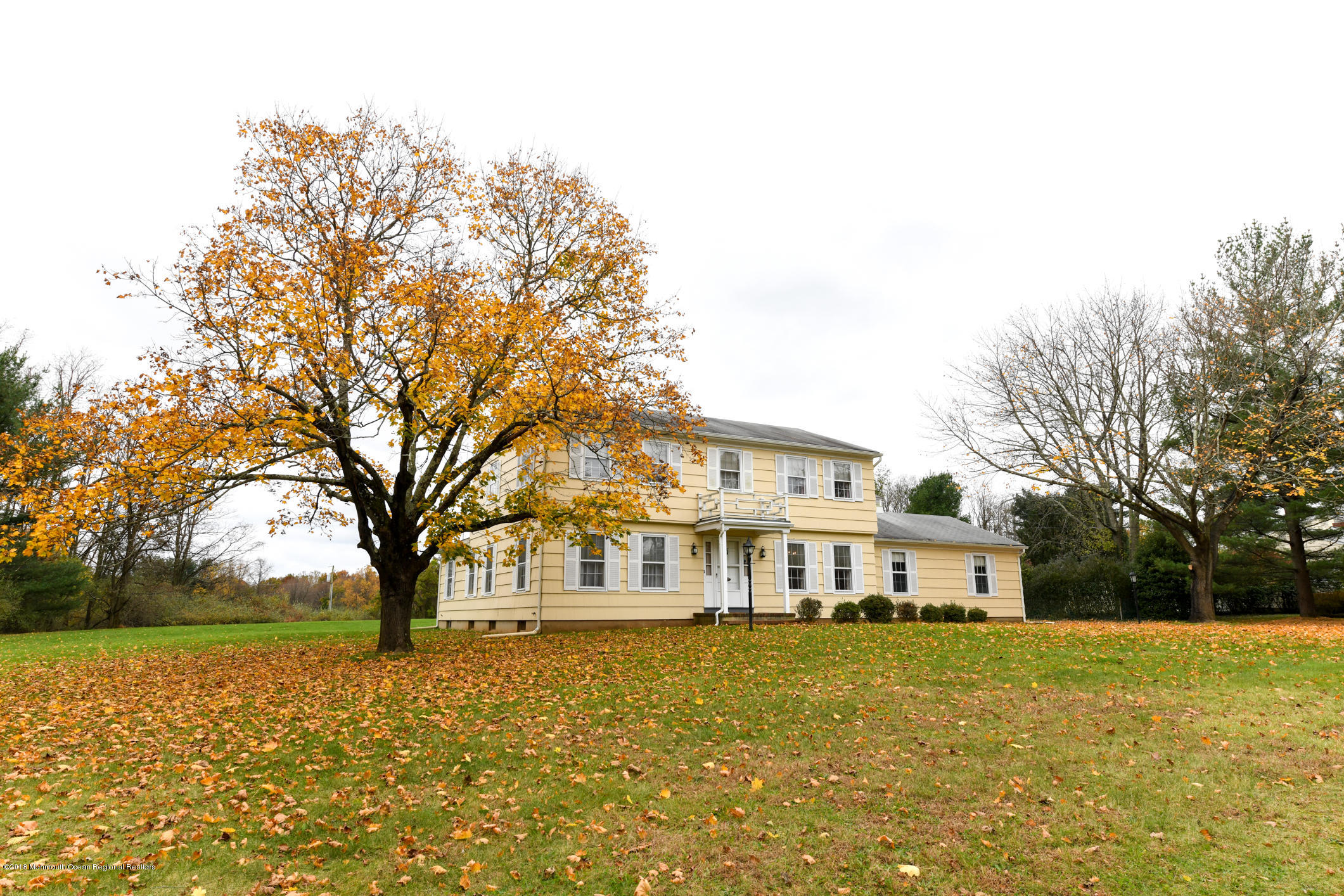 2 Green Hill Road Colts Neck, NJ 07722 - Photo 30 of 30 a front view of residential houses with yard and trees