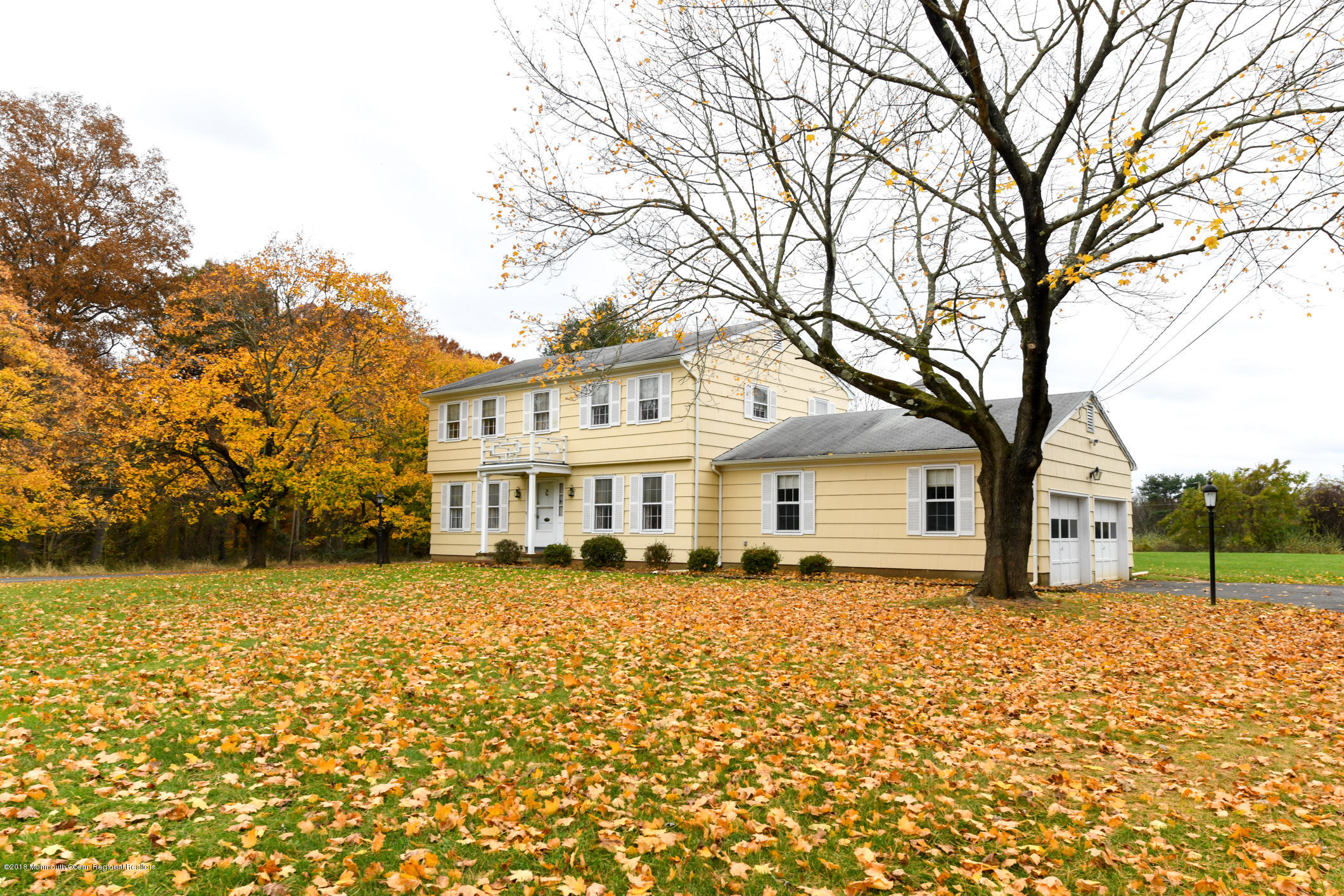 2 Green Hill Road Colts Neck, NJ 07722 - Photo 3 of 30 a house that has a tree in front of the house