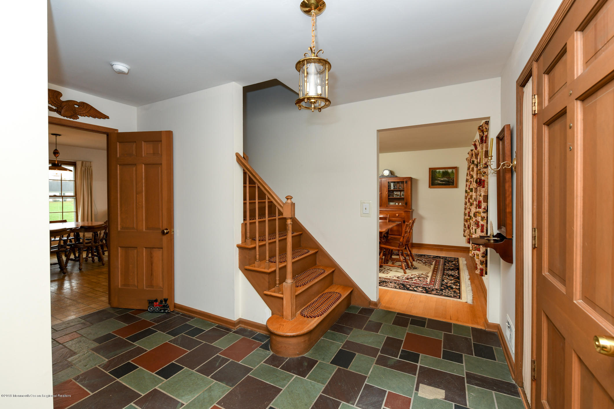 2 Green Hill Road Colts Neck, NJ 07722 - Photo 4 of 30 a view of a hallway with wooden floor and staircase