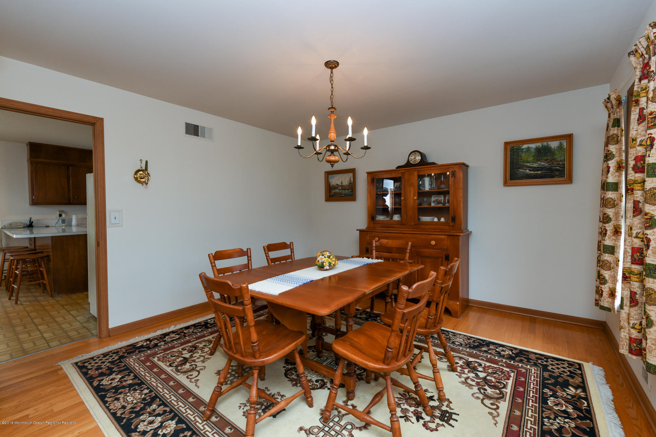 2 Green Hill Road Colts Neck, NJ 07722 - Photo 5 of 30 a dining room with chandelier and wooden floor