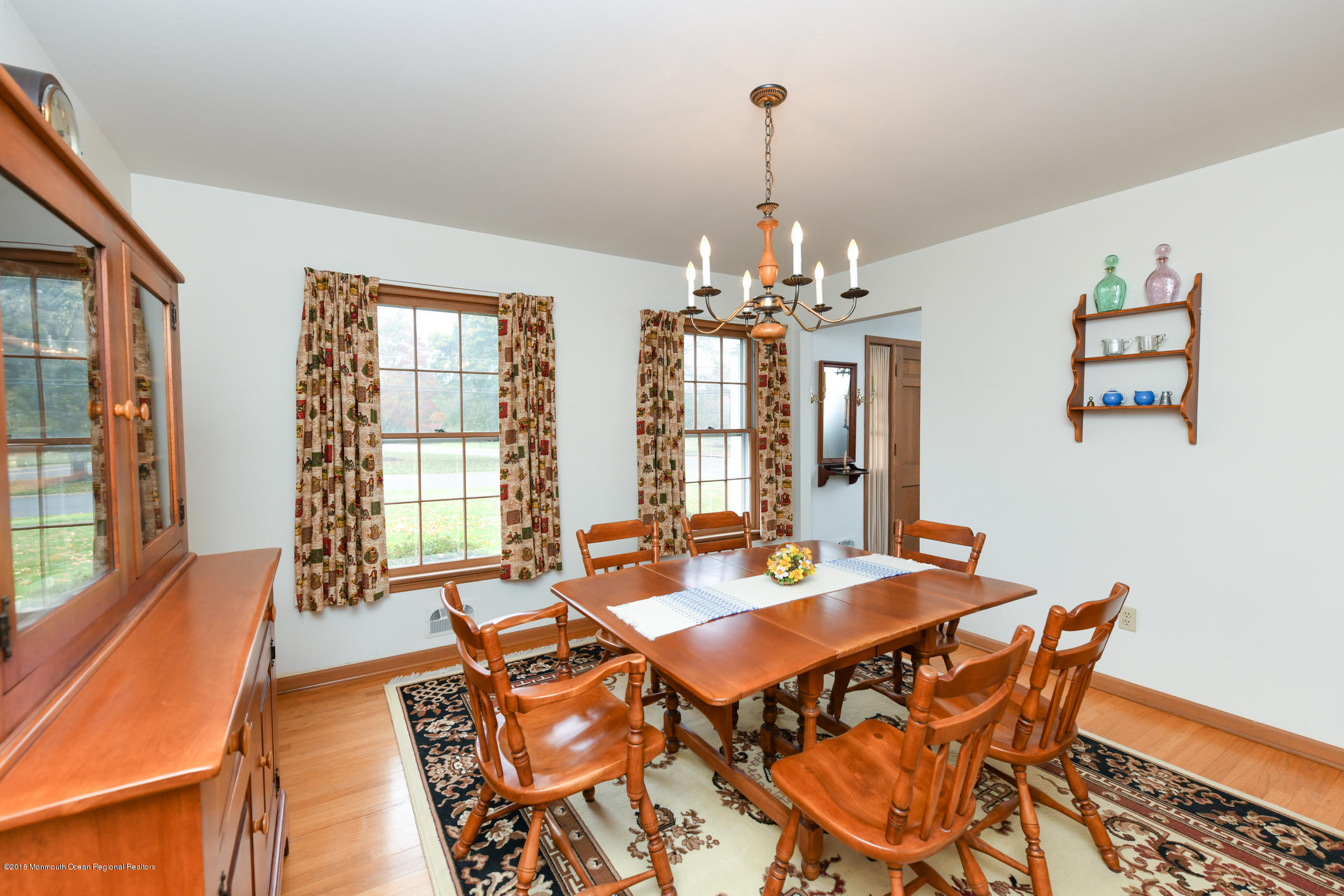 2 Green Hill Road Colts Neck, NJ 07722 - Photo 6 of 30 a view of a dining room with furniture wooden floor and chandelier