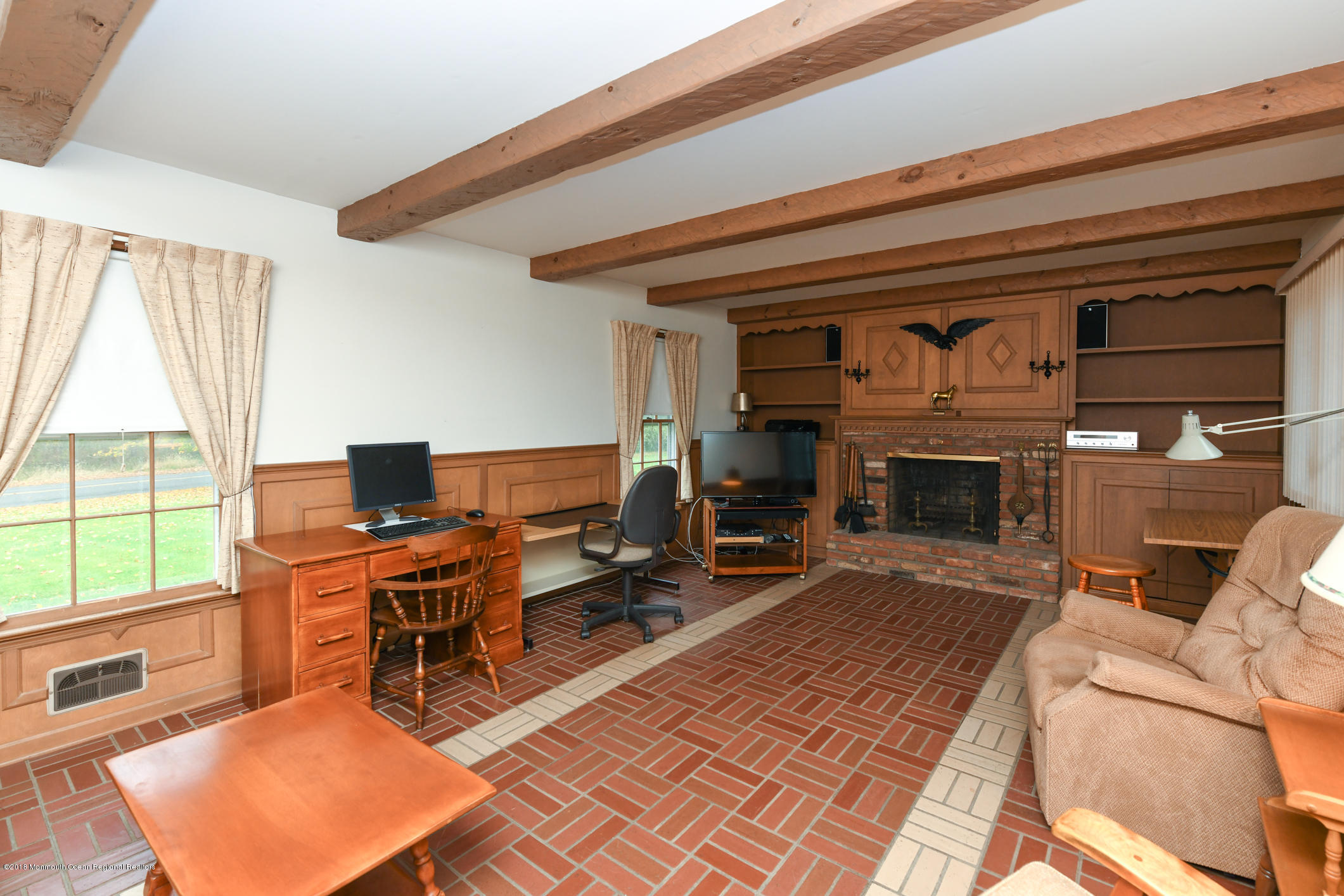 2 Green Hill Road Colts Neck, NJ 07722 - Photo 10 of 30 a living room with furniture a fireplace and a table