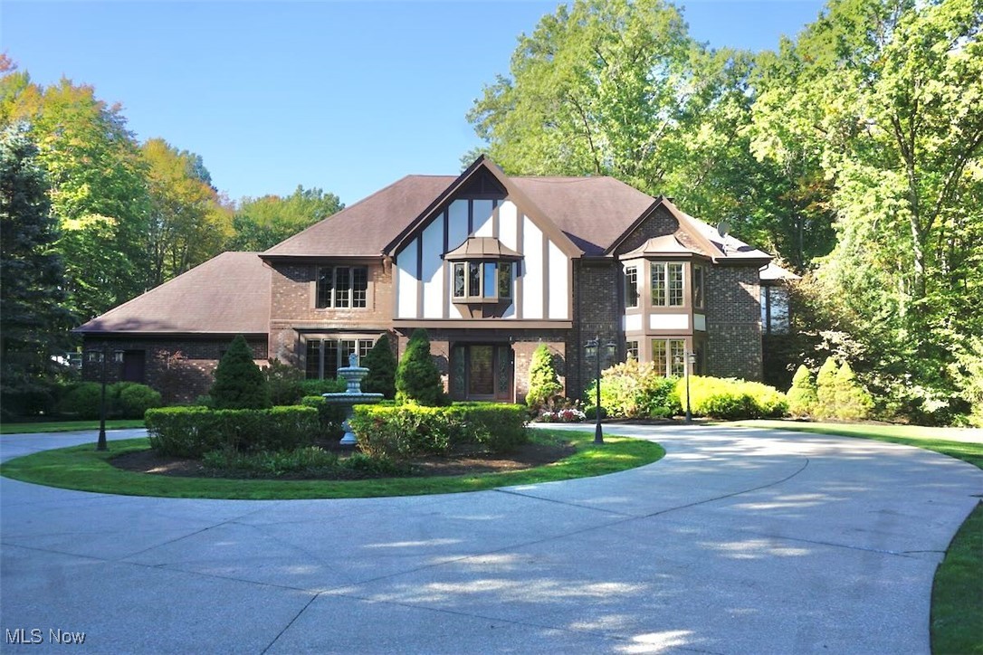 1760 Chartley Road Gates Mills, OH 44040 - Photo 1 of 49 Tudor-style house featuring brick construction and curved driveway