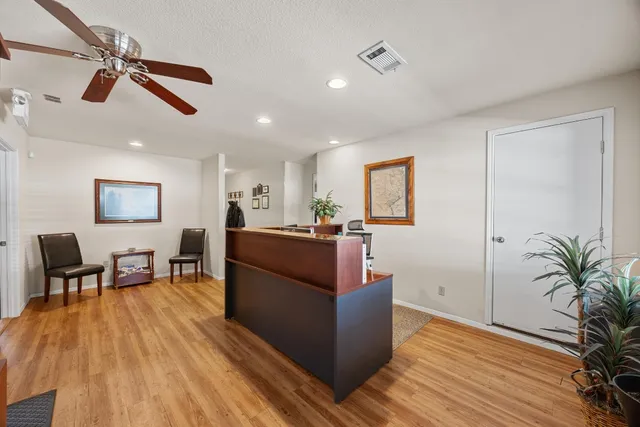 a living room with furniture and a bookshelf
