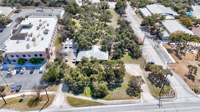 an aerial view of a house with yard swimming pool and outdoor seating