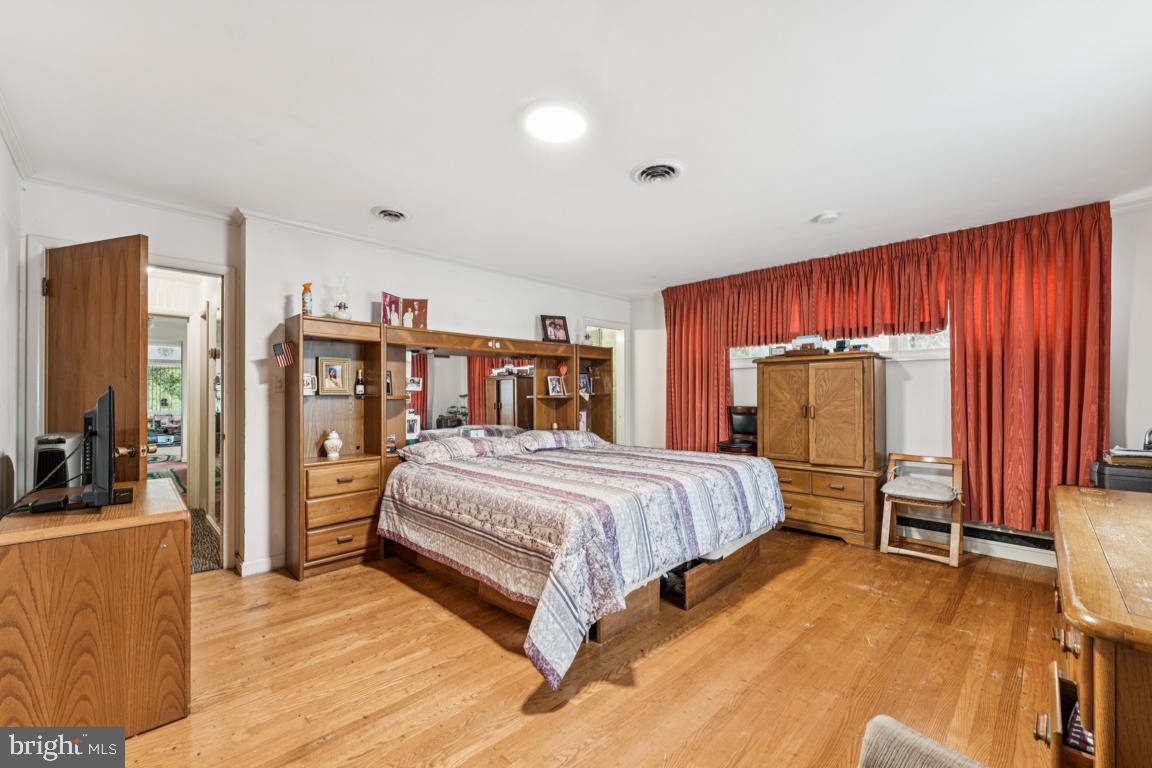 4910 Stan Haven Road Temple Hills, MD 20748 - Photo 11 of 25 a bedroom with a bed and a large window