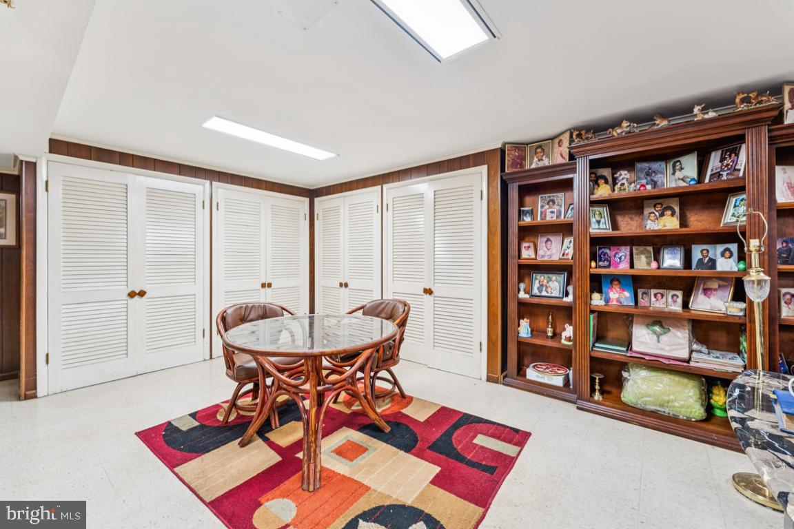 4910 Stan Haven Road Temple Hills, MD 20748 - Photo 15 of 25 a living room with furniture and a book shelf