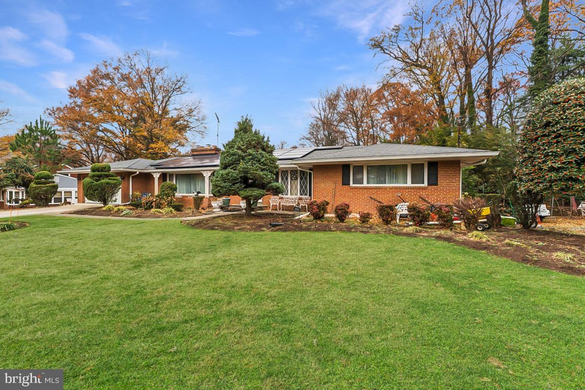 4910 Stan Haven Road Temple Hills, MD 20748 - Photo 2 of 25 a front view of a house with garden