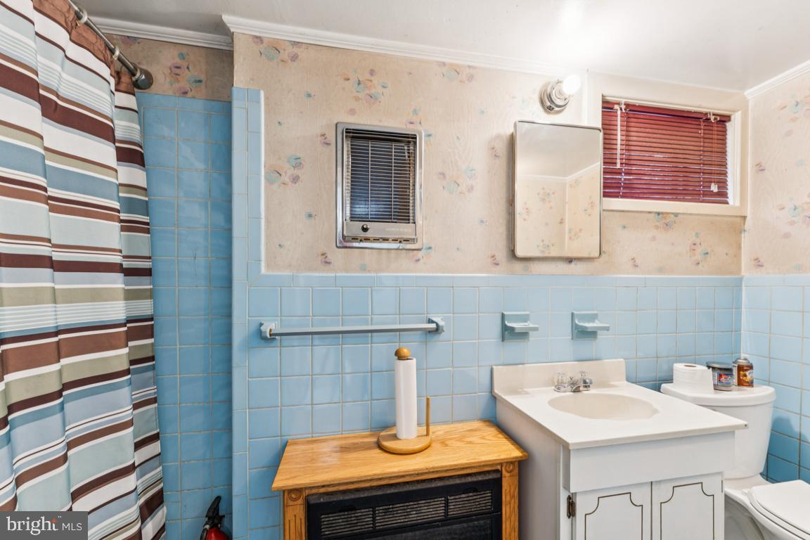 4910 Stan Haven Road Temple Hills, MD 20748 - Photo 22 of 25 a bathroom with a sink a vanity and a mirror
