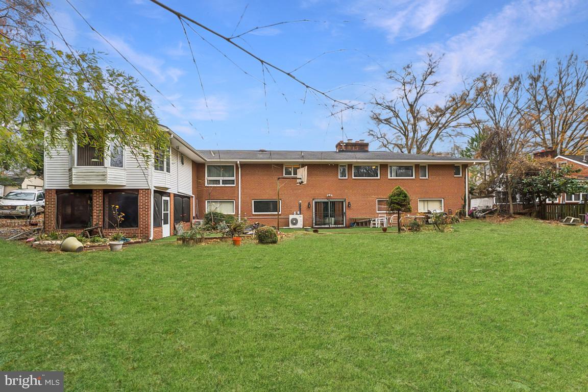 4910 Stan Haven Road Temple Hills, MD 20748 - Photo 24 of 25 a view of a yard with a table and chairs in front of house