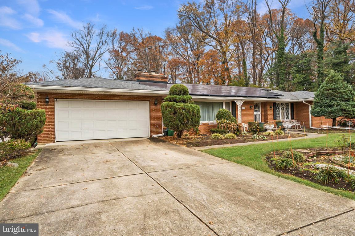 4910 Stan Haven Road Temple Hills, MD 20748 - Photo 3 of 25 a front view of a house with garden