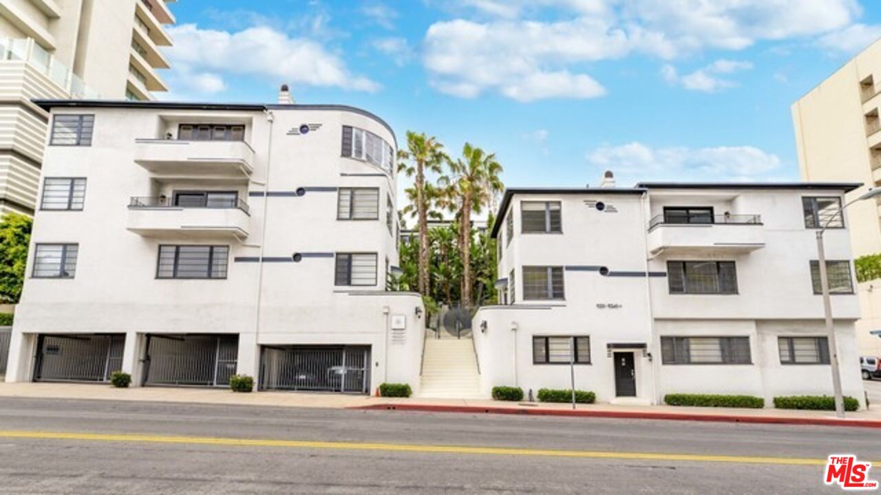 9233 1/2 Doheny Road West Hollywood, CA 90069 - Photo 2 of 17 a view of a building with a balcony